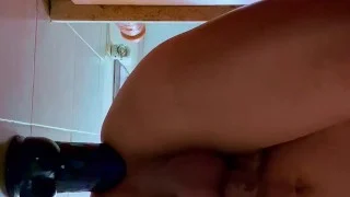 Latino boy playing with dildos in the shower