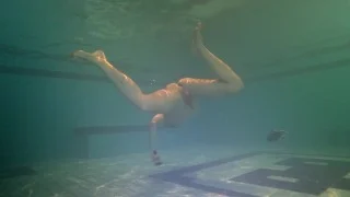 Tight ass finds dildo underwater and swims with it
