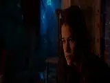 Angelina Jolie first pulling her shirt over her head to
