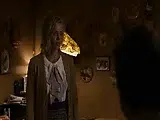 Charlize Theron undressing down to her underwear, revealing