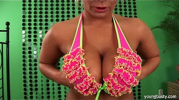 Busty young Lucie peeing