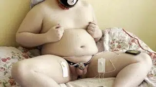 Locked Chub Enjoying Dual Channel E-Stim On Metal Plug And Chastity Cage