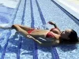 Monika Fox Swims In The Pool In A Red Bikini