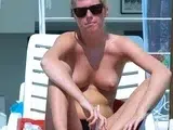 Pretty nudist teens enjoys her summer topless outdoors
