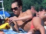 Nude beach girl filmed enjoying a sunny day at the beach